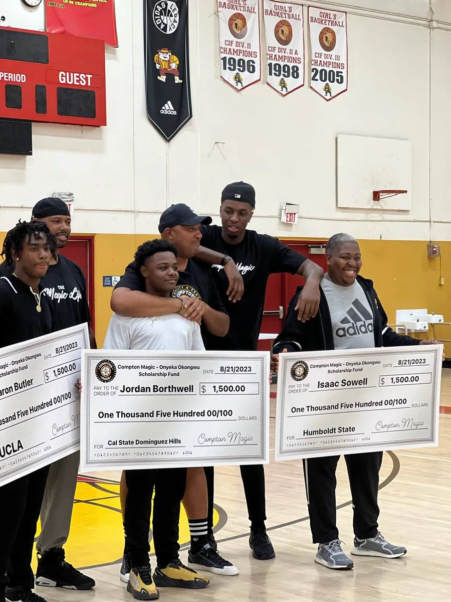 Compton Magic athletes and leaders presenting college scholarship awards in a gym