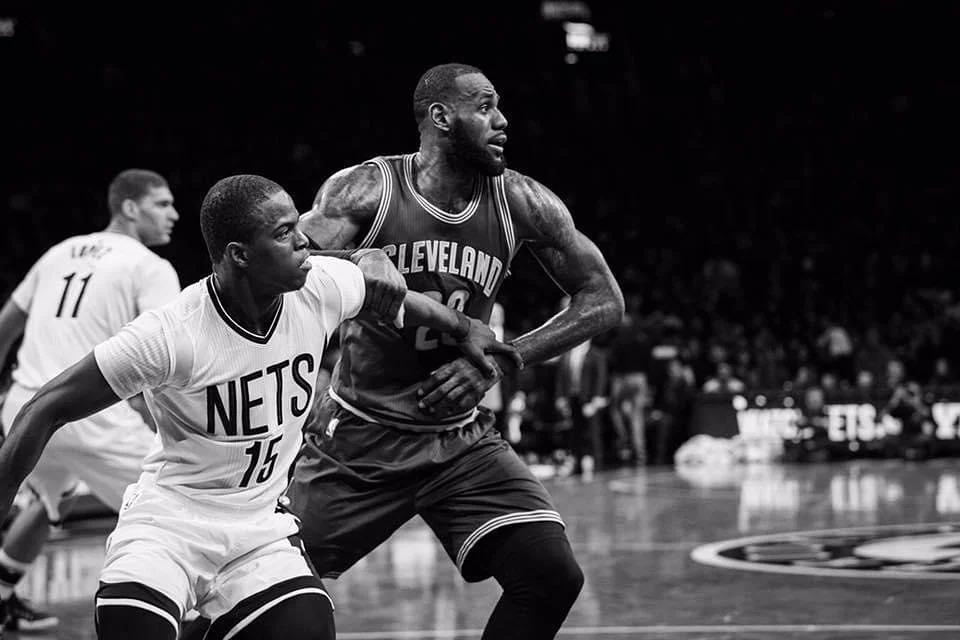 Isaiah Whitehead defending LeBron James during an NBA game